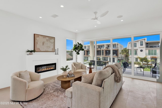 114 12th Ave S Unit 102, Jacksonville Beach, FL 32250 - living area with ceiling fan, a glass covered fireplace, and recessed lighting