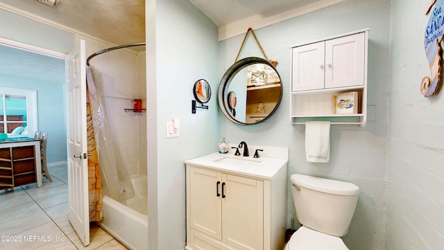 bathroom with tile patterned flooring, vanity, shower / tub combo, and toilet