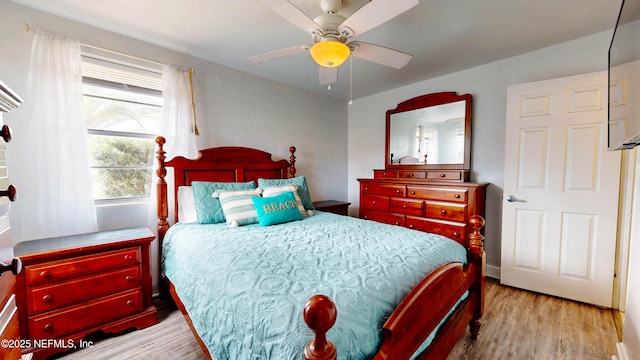 bedroom featuring wood finished floors and a ceiling fan