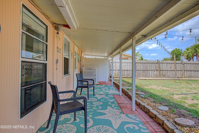 view of patio / terrace featuring fence