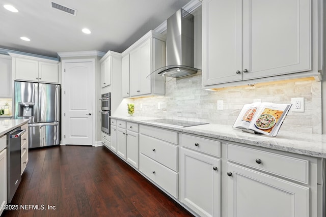 123 Tree Side Ln, Ponte Vedra, FL 32081 - kitchen with appliances with stainless steel finishes, wall chimney exhaust hood, white cabinetry, dark wood finished floors, and recessed lighting