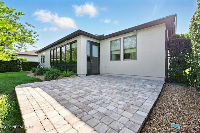 123 Tree Side Ln, Ponte Vedra, FL 32081 - rear view of house with a patio and stucco siding