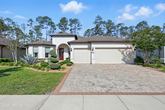 123 Tree Side Ln, Ponte Vedra, FL 32081 - view of front of house featuring an attached garage, decorative driveway, stucco siding, and a front yard