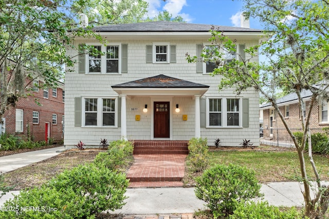 3577 Valencia Rd, Jacksonville, FL 32205 - colonial-style house with a chimney and a shingled roof