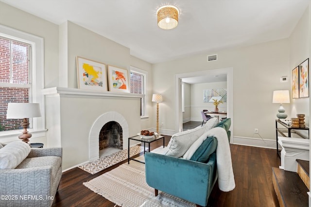 3577 Valencia Rd, Jacksonville, FL 32205 - living room with a fireplace with flush hearth, hardwood / wood-style flooring, baseboards, and plenty of natural light