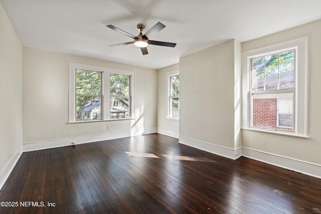 3577 Valencia Rd, Jacksonville, FL 32205 - empty room featuring healthy amount of natural light, wood-type flooring, ceiling fan, and baseboards