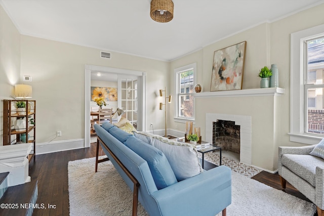 3577 Valencia Rd, Jacksonville, FL 32205 - living area with plenty of natural light, wood finished floors, ornamental molding, baseboards, and a fireplace with flush hearth