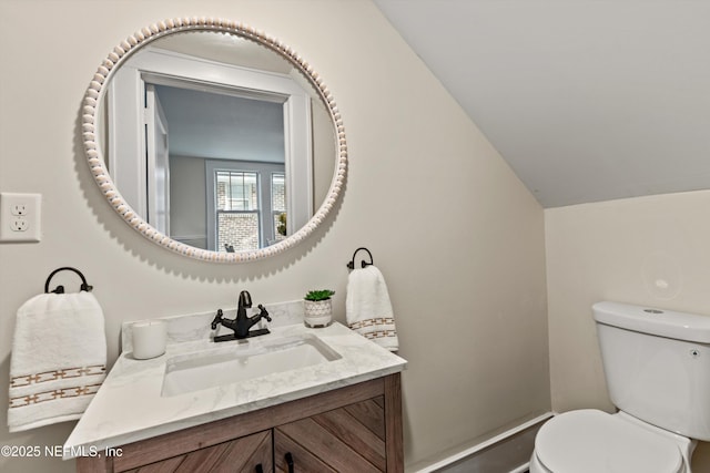 3577 Valencia Rd, Jacksonville, FL 32205 - half bathroom with toilet, vanity, and vaulted ceiling