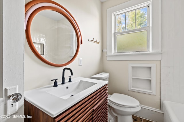 3577 Valencia Rd, Jacksonville, FL 32205 - full bathroom featuring toilet, built in features, vanity, and a tub to relax in