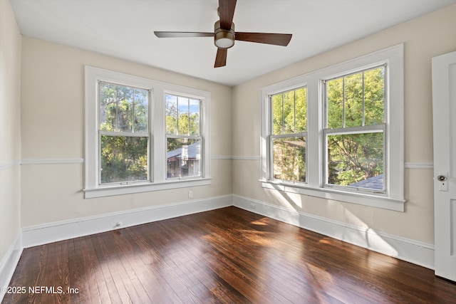 3577 Valencia Rd, Jacksonville, FL 32205 - spare room featuring dark wood finished floors, baseboards, and ceiling fan