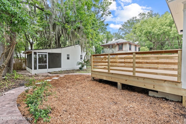 3577 Valencia Rd, Jacksonville, FL 32205 - view of yard with a sunroom and a wooden deck