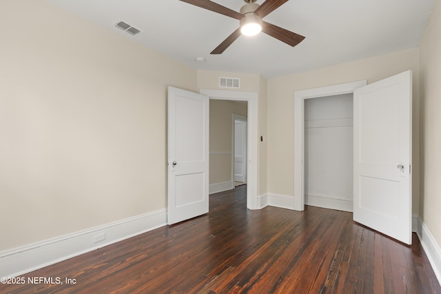 3577 Valencia Rd, Jacksonville, FL 32205 - unfurnished bedroom with dark wood-style floors, baseboards, a closet, and ceiling fan