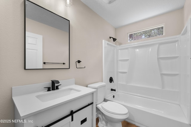 full bath with vanity, toilet, and bathtub / shower combination