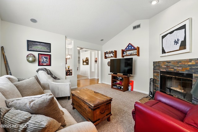 364 Maplewood Dr, Saint Johns, FL 32259 - carpeted living area with lofted ceiling, a fireplace, and baseboards