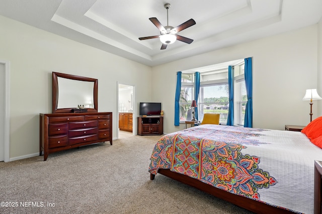 364 Maplewood Dr, Saint Johns, FL 32259 - carpeted bedroom with a tray ceiling, a ceiling fan, and ensuite bath