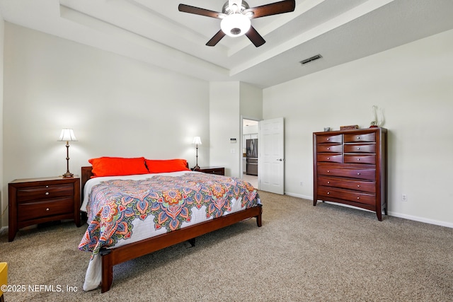 364 Maplewood Dr, Saint Johns, FL 32259 - carpeted bedroom with stainless steel fridge with ice dispenser, baseboards, a tray ceiling, and a ceiling fan