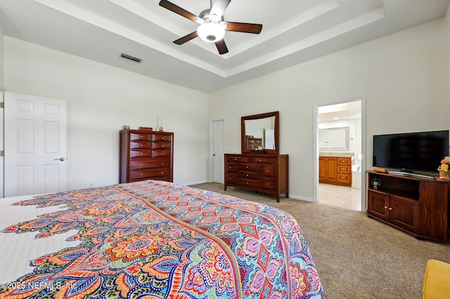 364 Maplewood Dr, Saint Johns, FL 32259 - bedroom with light colored carpet, a tray ceiling, ceiling fan, ensuite bathroom, and a towering ceiling