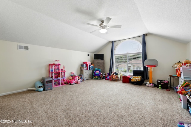 364 Maplewood Dr, Saint Johns, FL 32259 - playroom with carpet flooring, vaulted ceiling, a ceiling fan, and a textured ceiling