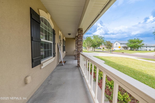 2443 Royal Pointe Dr, Green Cove Springs, FL 32043 - balcony featuring a porch and a residential view