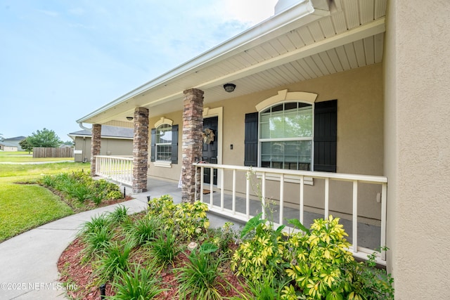 2443 Royal Pointe Dr, Green Cove Springs, FL 32043 - property entrance with stucco siding and covered porch