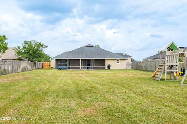 2443 Royal Pointe Dr, Green Cove Springs, FL 32043 - rear view of house with a sunroom, a playground, and a shingled roof
