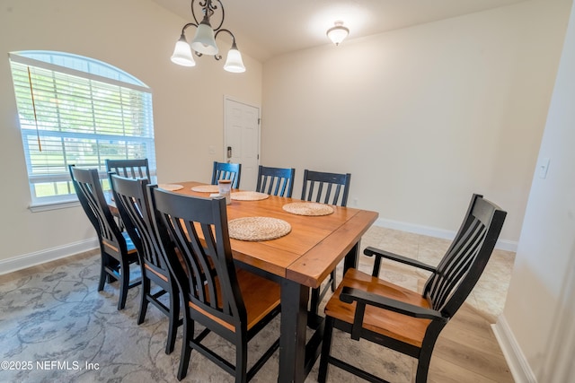 2443 Royal Pointe Dr, Green Cove Springs, FL 32043 - dining space with baseboards and a chandelier