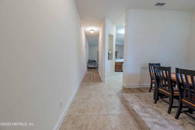 2443 Royal Pointe Dr, Green Cove Springs, FL 32043 - hallway with baseboards and light tile patterned flooring