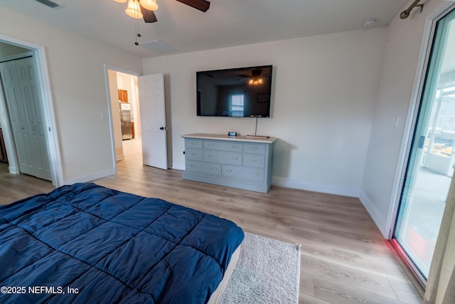 2443 Royal Pointe Dr, Green Cove Springs, FL 32043 - bedroom with light wood-style floors, baseboards, and a ceiling fan