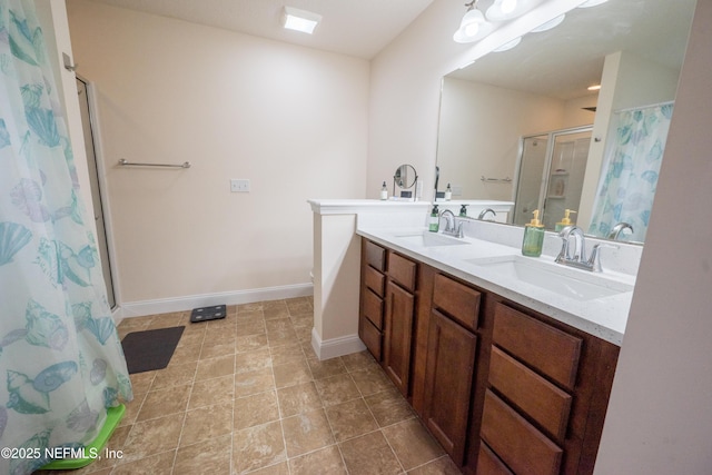 2443 Royal Pointe Dr, Green Cove Springs, FL 32043 - bathroom with a shower stall, double vanity, and baseboards