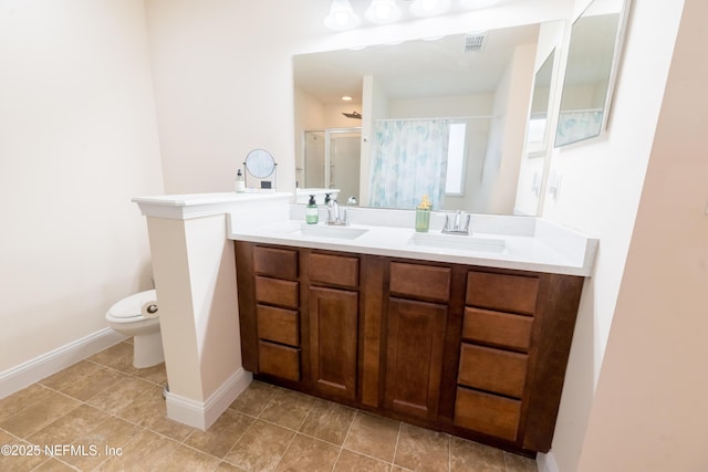 2443 Royal Pointe Dr, Green Cove Springs, FL 32043 - bathroom featuring a stall shower, double vanity, toilet, tile patterned flooring, and baseboards