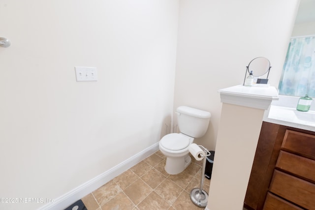 2443 Royal Pointe Dr, Green Cove Springs, FL 32043 - bathroom featuring toilet, vanity, and baseboards