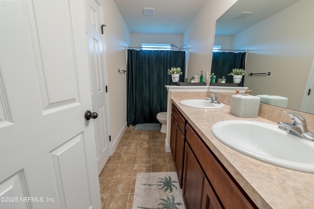 2443 Royal Pointe Dr, Green Cove Springs, FL 32043 - full bathroom with toilet, double vanity, and a shower with shower curtain