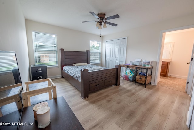2443 Royal Pointe Dr, Green Cove Springs, FL 32043 - bedroom featuring light wood finished floors, baseboards, a closet, and a ceiling fan