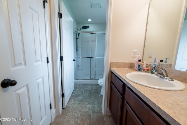 2443 Royal Pointe Dr, Green Cove Springs, FL 32043 - bathroom featuring a stall shower, vanity, toilet, and recessed lighting