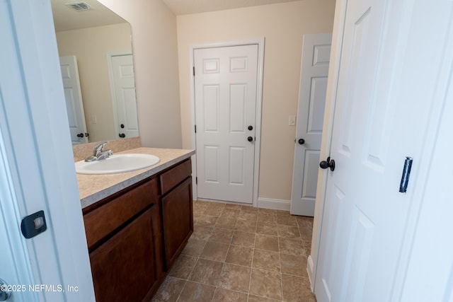 2443 Royal Pointe Dr, Green Cove Springs, FL 32043 - bathroom with vanity and baseboards