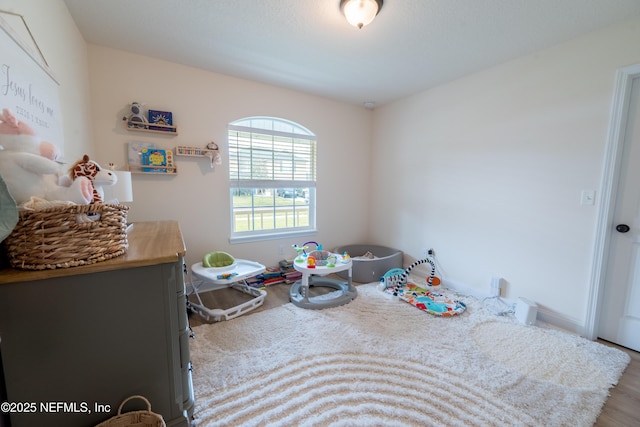 2443 Royal Pointe Dr, Green Cove Springs, FL 32043 - bedroom with wood finished floors and baseboards