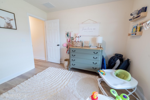 2443 Royal Pointe Dr, Green Cove Springs, FL 32043 - bedroom with light wood-style floors and baseboards