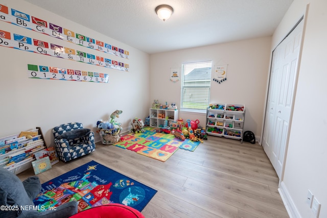 2443 Royal Pointe Dr, Green Cove Springs, FL 32043 - playroom featuring wood finished floors