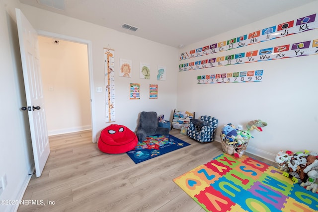 2443 Royal Pointe Dr, Green Cove Springs, FL 32043 - rec room with wood finished floors and baseboards