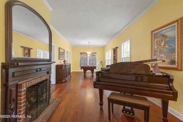 195 S Roscoe Blvd, Ponte Vedra Beach, FL 32082 - living area with wood finished floors, crown molding, pool table, a fireplace, and baseboards