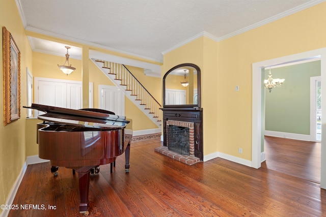 195 S Roscoe Blvd, Ponte Vedra Beach, FL 32082 - sitting room featuring wood finished floors, ornamental molding, a chandelier, stairway, and baseboards