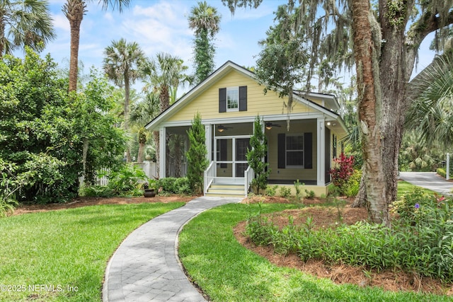 195 S Roscoe Blvd, Ponte Vedra Beach, FL 32082 - bungalow-style house with a ceiling fan, a front yard, and a sunroom