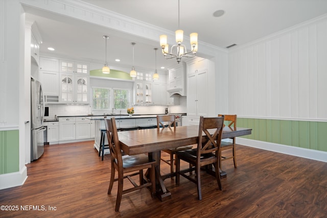 195 S Roscoe Blvd, Ponte Vedra Beach, FL 32082 - dining space featuring dark wood finished floors, a chandelier, crown molding, and baseboards