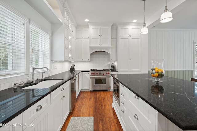 195 S Roscoe Blvd, Ponte Vedra Beach, FL 32082 - kitchen featuring appliances with stainless steel finishes, a sink, white cabinets, decorative backsplash, and recessed lighting