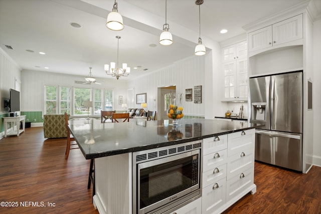 195 S Roscoe Blvd, Ponte Vedra Beach, FL 32082 - kitchen with stainless steel appliances, a chandelier, a kitchen breakfast bar, white cabinetry, and dark wood-style flooring