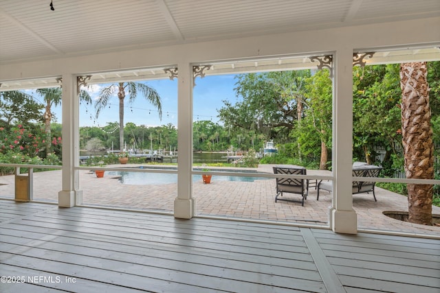 195 S Roscoe Blvd, Ponte Vedra Beach, FL 32082 - wooden deck featuring an outdoor pool, a patio area, a water view, and view of scattered trees