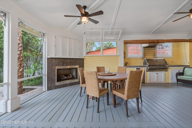 195 S Roscoe Blvd, Ponte Vedra Beach, FL 32082 - dining space featuring a ceiling fan, wood-type flooring, healthy amount of natural light, beamed ceiling, and a fireplace