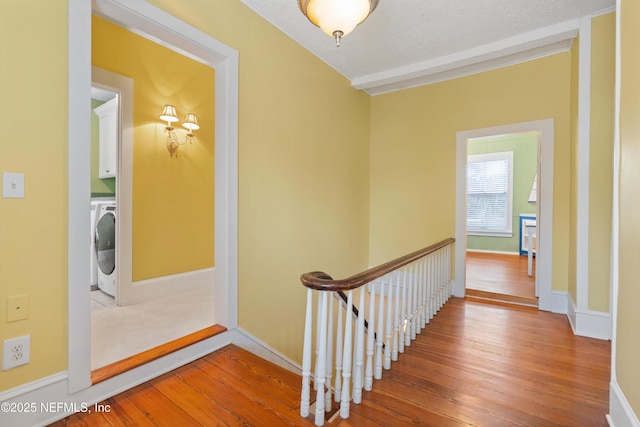 195 S Roscoe Blvd, Ponte Vedra Beach, FL 32082 - hall with hardwood / wood-style flooring, washer / clothes dryer, baseboards, and an upstairs landing