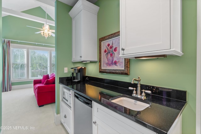 195 S Roscoe Blvd, Ponte Vedra Beach, FL 32082 - kitchen featuring dishwasher, a sink, white cabinetry, and dark stone counters