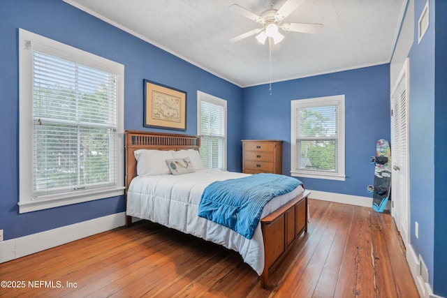 195 S Roscoe Blvd, Ponte Vedra Beach, FL 32082 - bedroom with baseboards, crown molding, hardwood / wood-style floors, and a ceiling fan